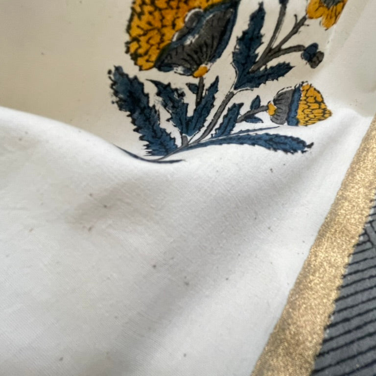 Close-up of a floral-patterned ceramic dish with a textured surface.