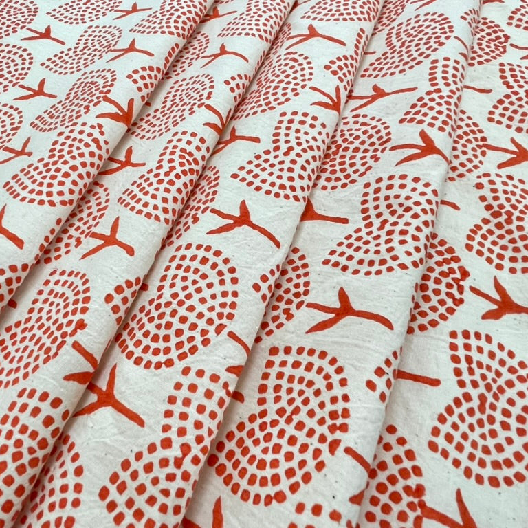 Fabric with red floral pattern on a white background