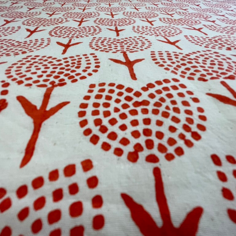 Textile with orange tulips floral patterns on a white background