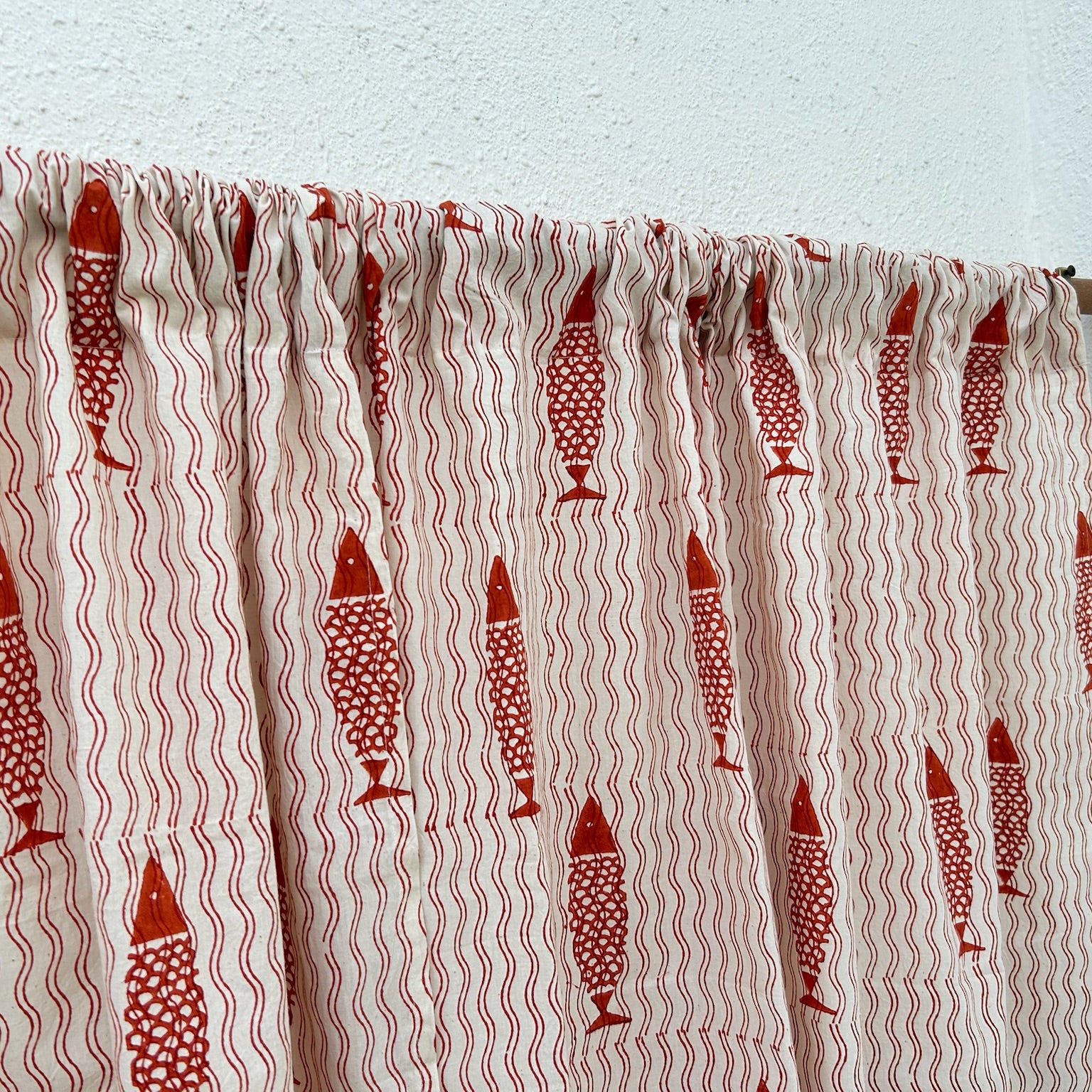 Textile with red fish pattern on a white background