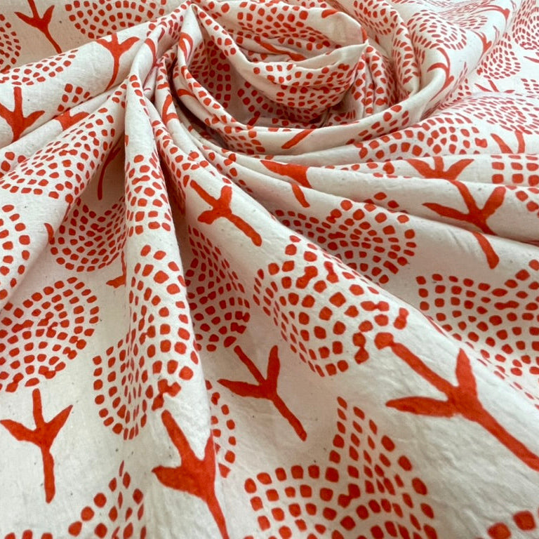 Fabric with red coral pattern on a white background