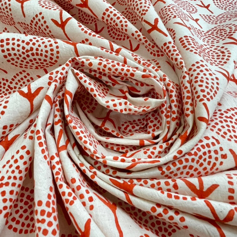 Roll of fabric with red and white pattern