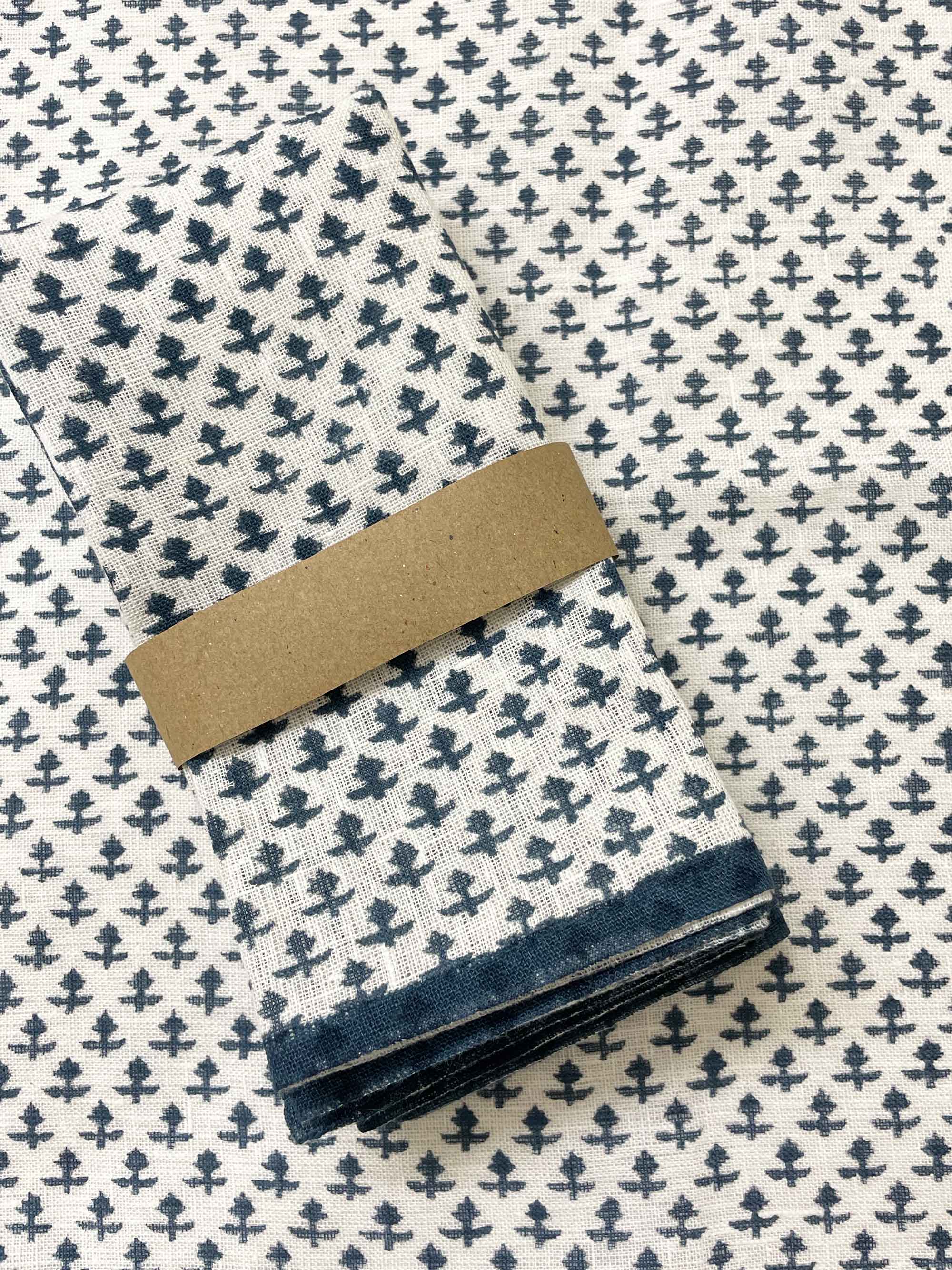 sustainable pure linen napkins arranged as placemats with cobalt blue hand block prints, stylish eco-friendly tableware
