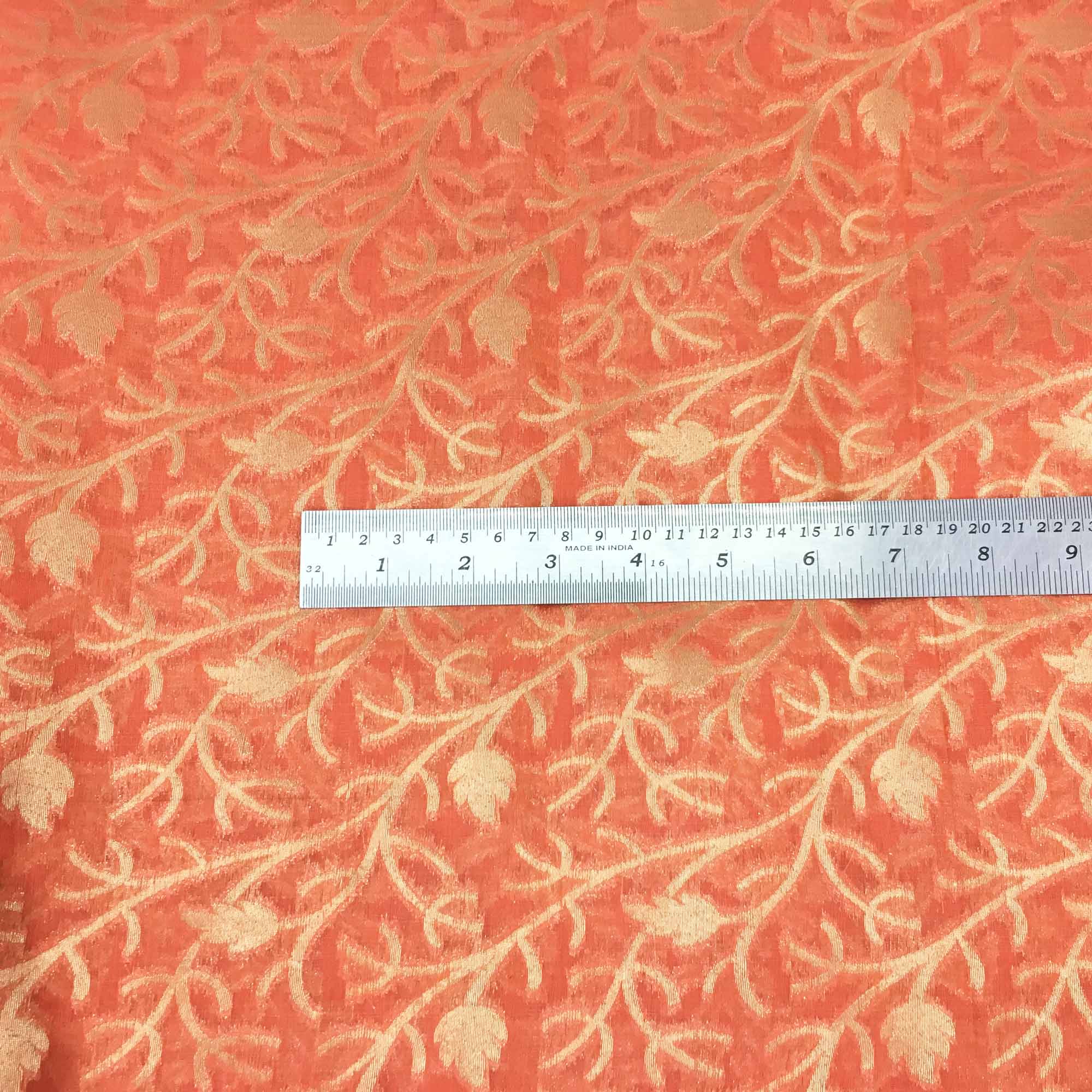 Gold and coral banarasi silk fabric