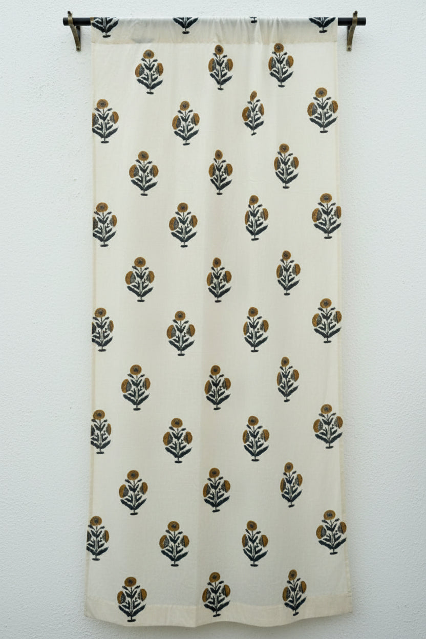 White curtain with black and green floral patterns on a white background