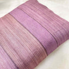 Purple textured pillow on a white background