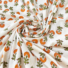 close up of small marigold allover print cotton fabric