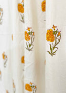 Close-up of a fabric with floral patterns on a white background