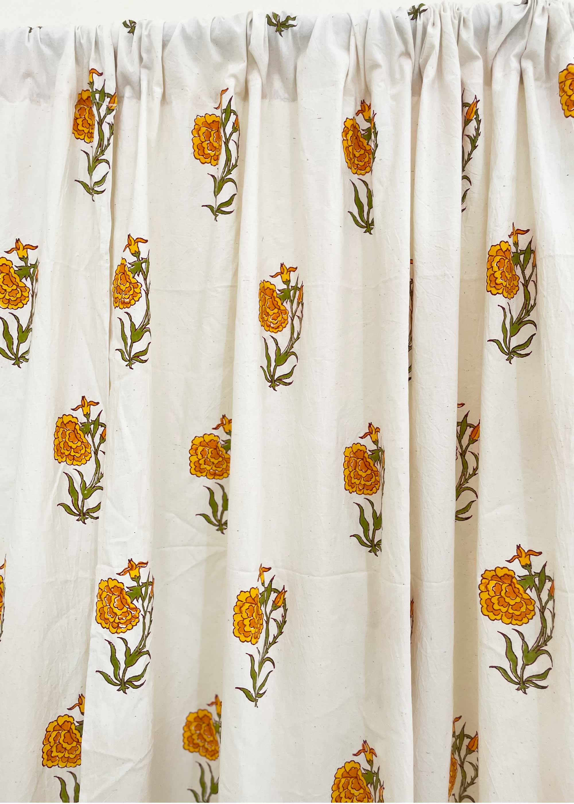 White fabric with orange floral patterns