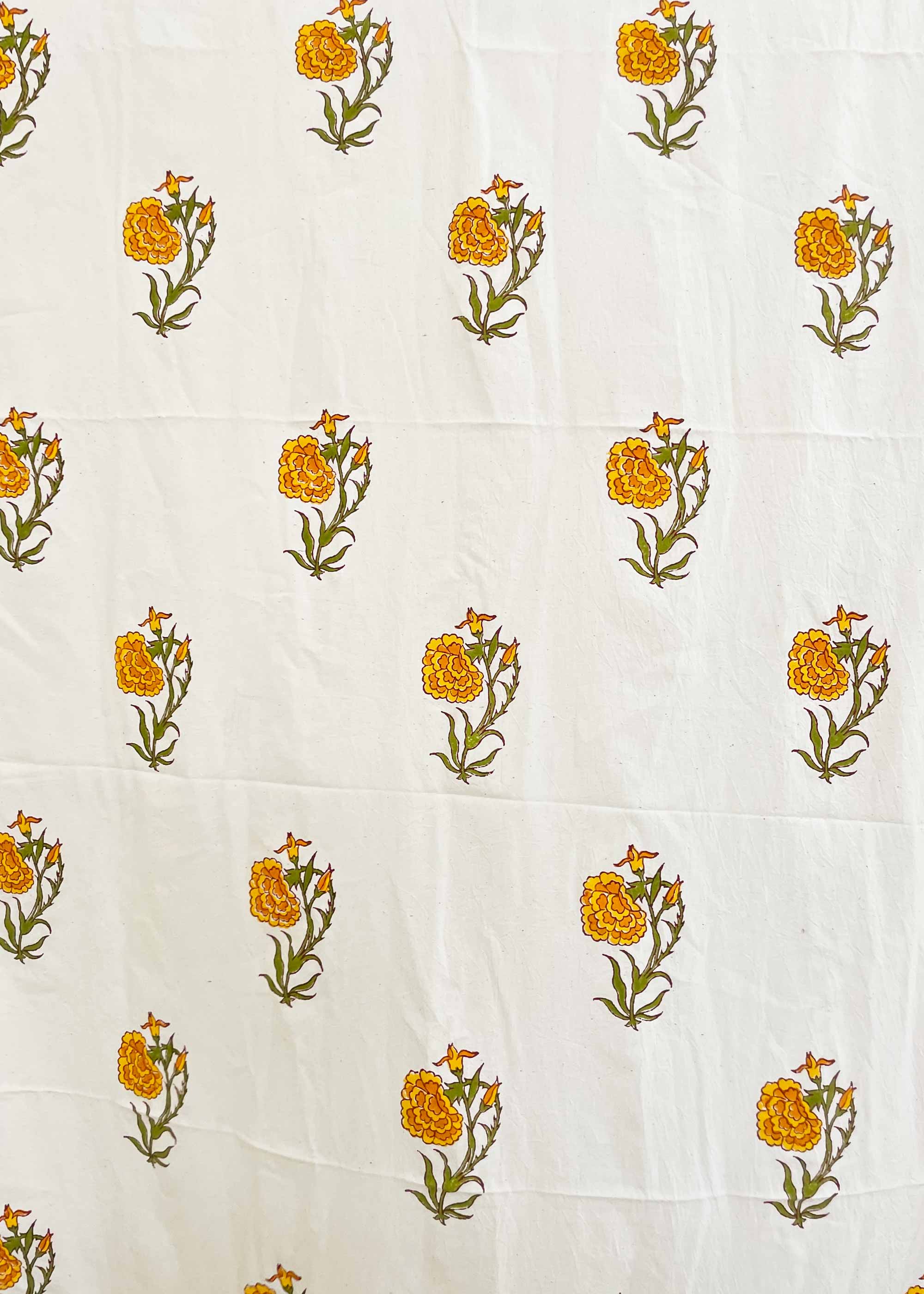 White fabric with yellow floral patterns