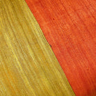 Rust and mustard colorblock tussar silk cushion cover woven by Indian artisans.