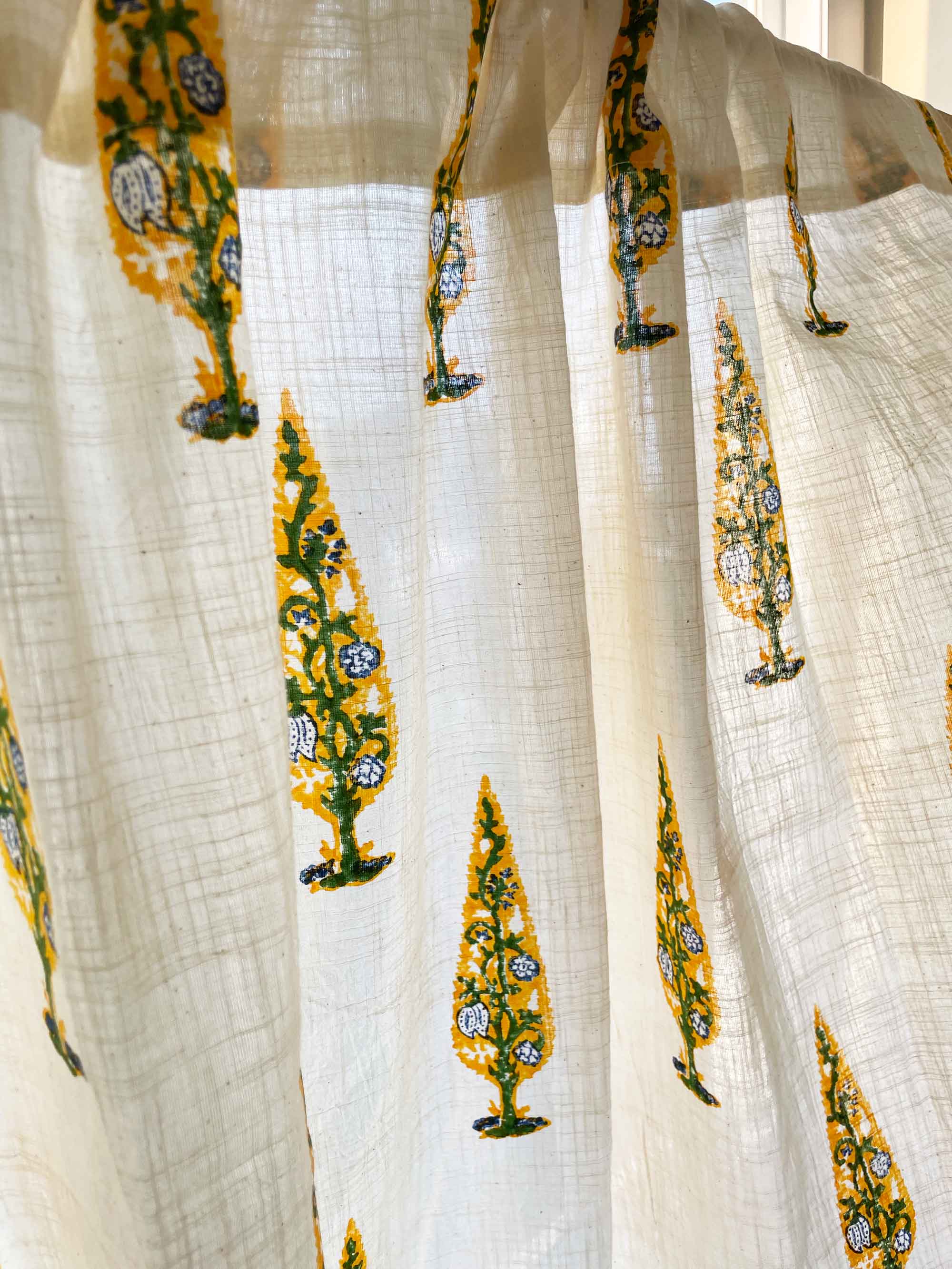 White fabric with yellow and green tree patterns